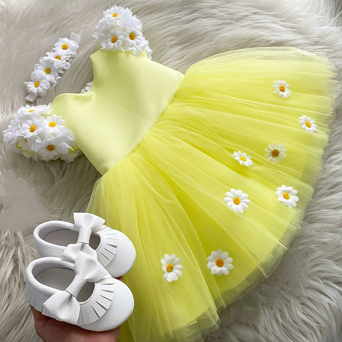 Yellow tulle frock with daisies for a baby girl
