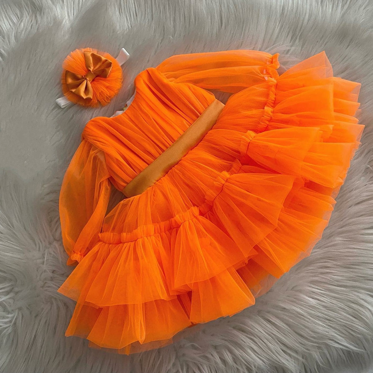 Orange tulle frock for a baby girl