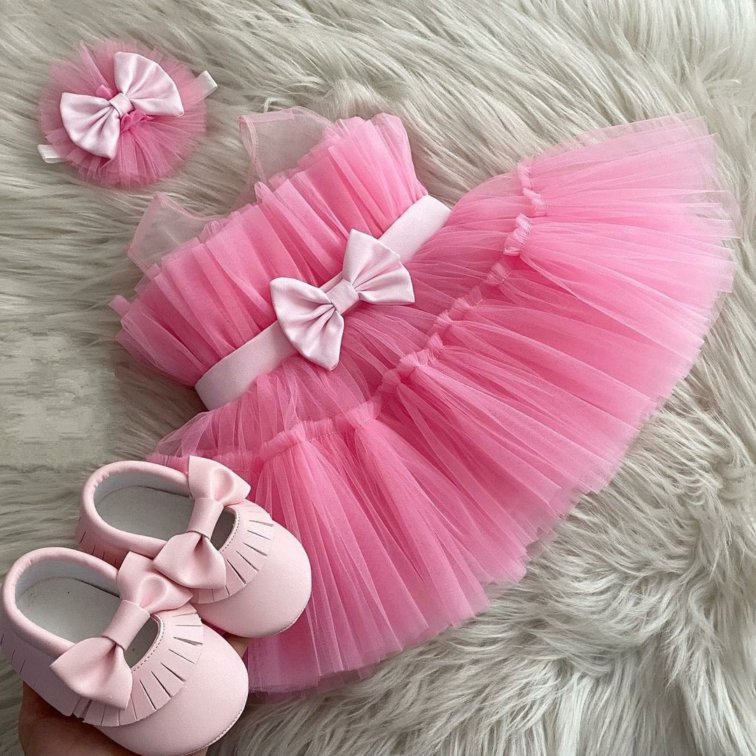 Pink layered tulle frock with bow for a baby girl