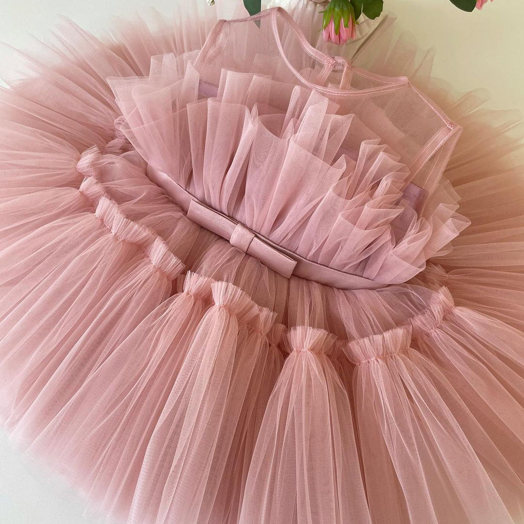 Blush tulle frock with satin sash for a baby girl