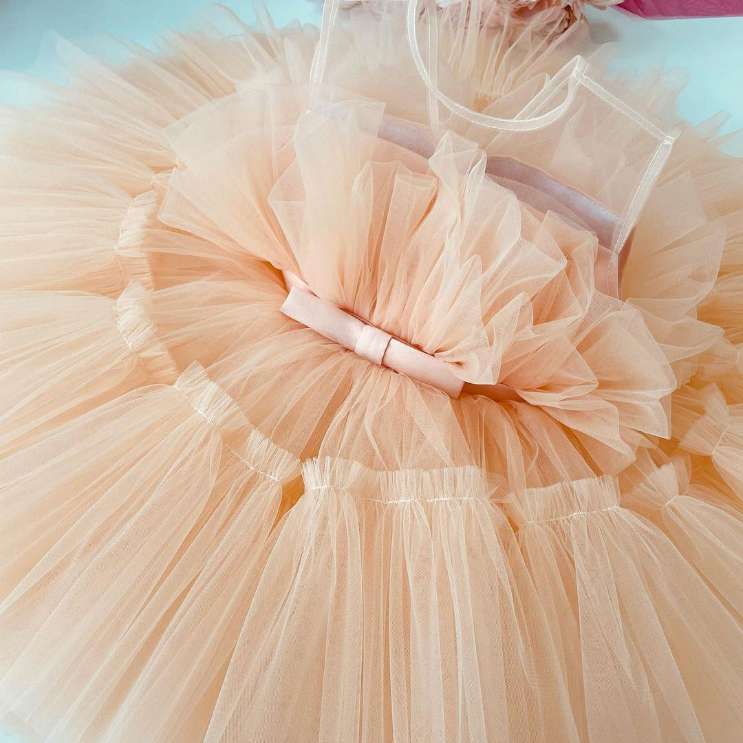 Peach tulle frock with bow for a baby girl