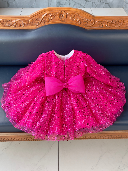 Magenta sequin frock with bow for a baby girl