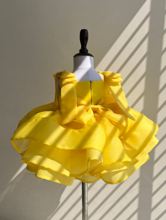 Yellow silk organza frock with bow for a baby girl