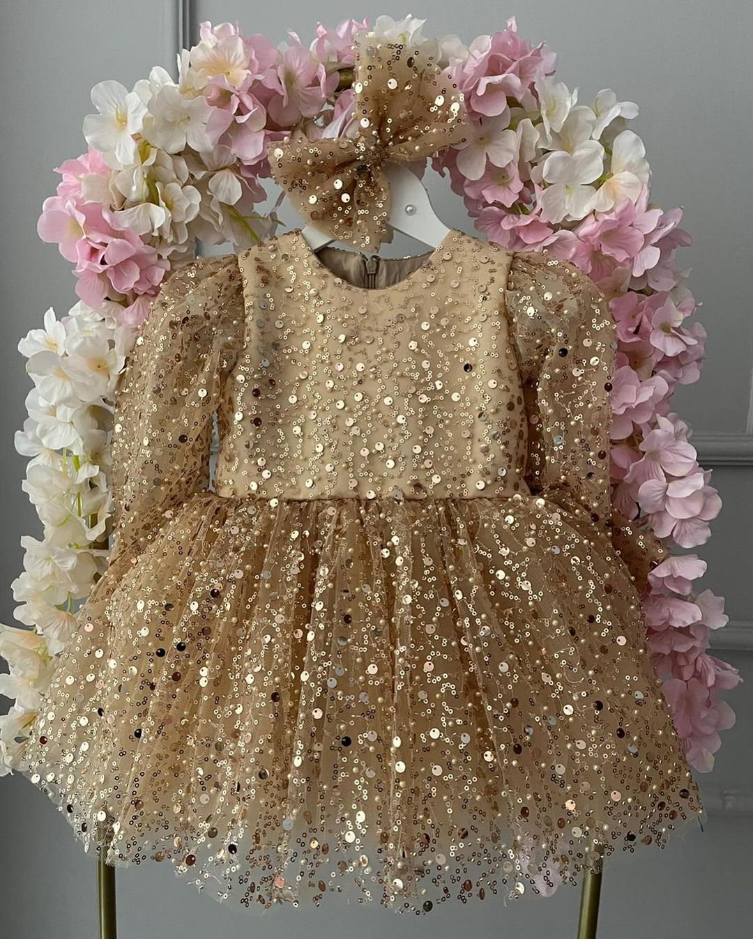 Gold sequin frock for a baby girl