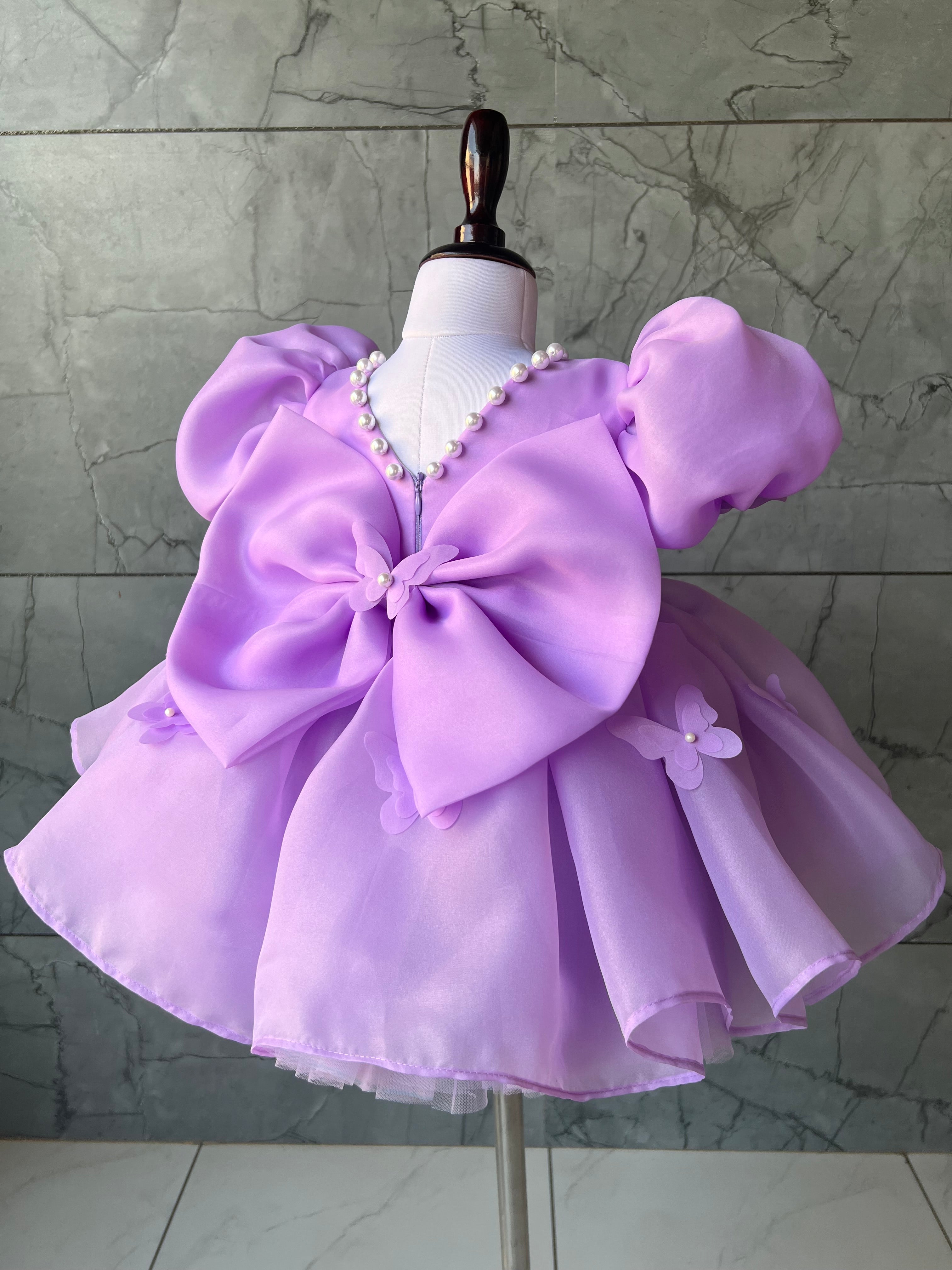 Lavender organza frock with bow for a baby girl