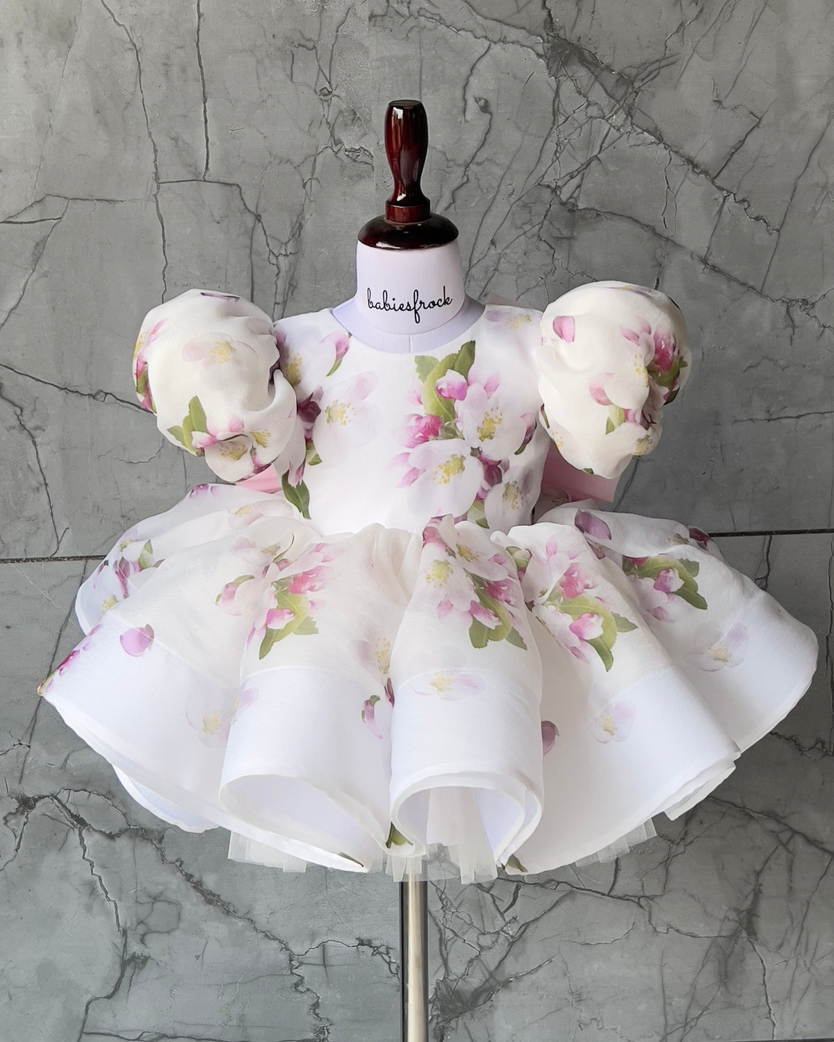 Floral print organza frock with pink bow for a baby girl