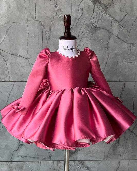 Blush satin gown with pearls for a baby girl