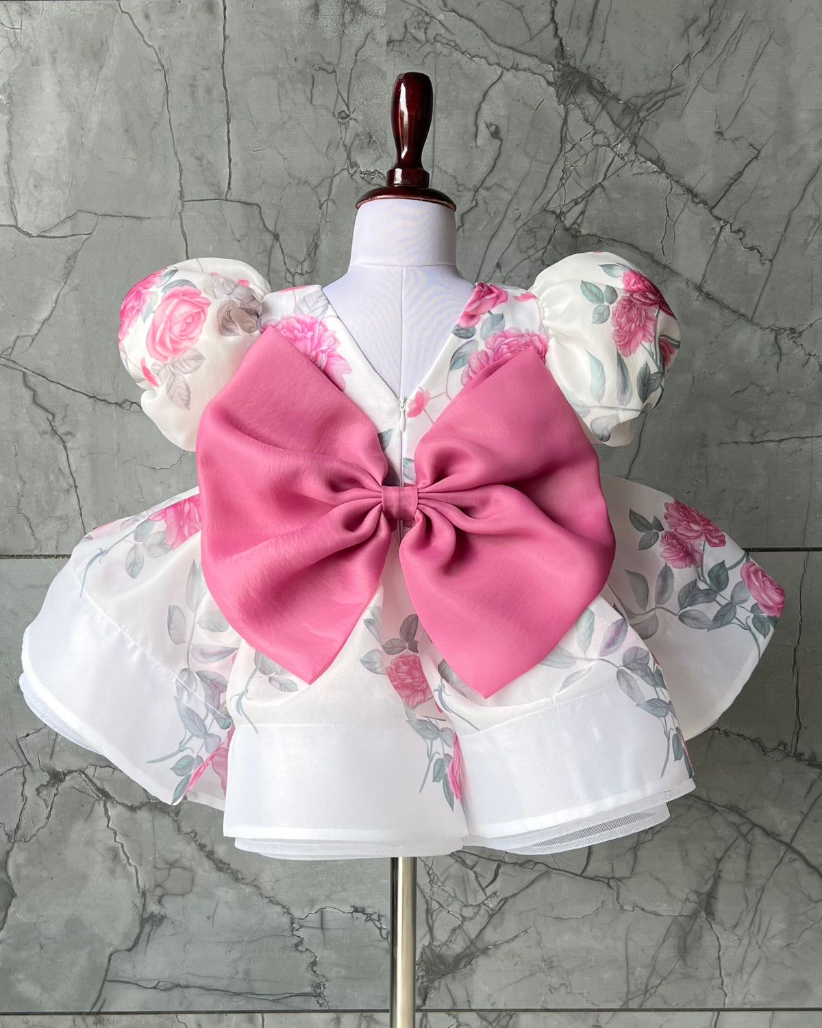 Rose print organza frock with pink bow for a baby girl