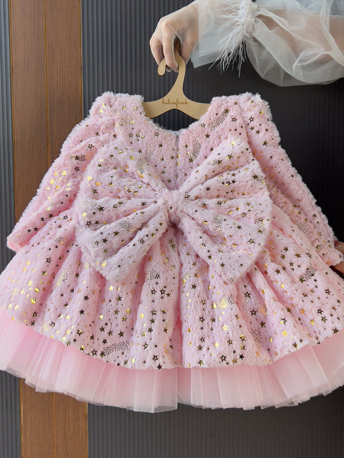 Pink starlight winter frock with bow for a baby girl