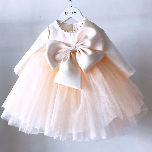 Ivory pearl tulle frock with bow for a baby girl