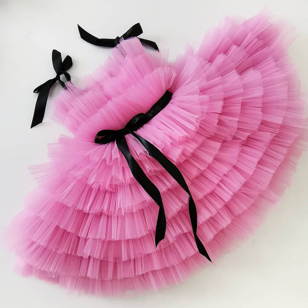 Pink tulle frock with black ribbon for a baby girl