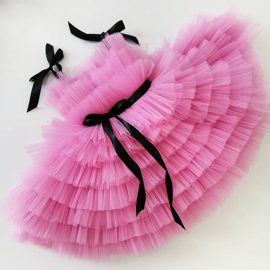 Pink tulle frock with black ribbon for a baby girl
