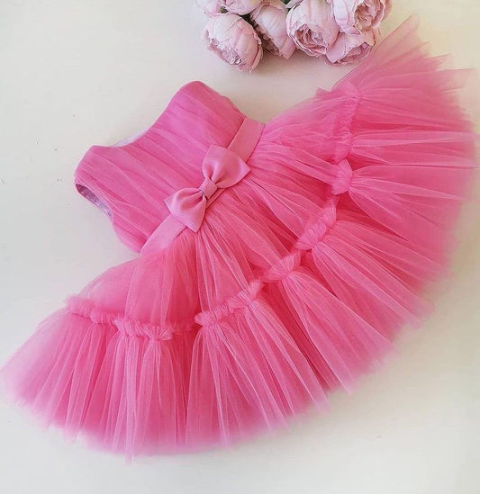Pink tulle frock with satin belt for a baby girl