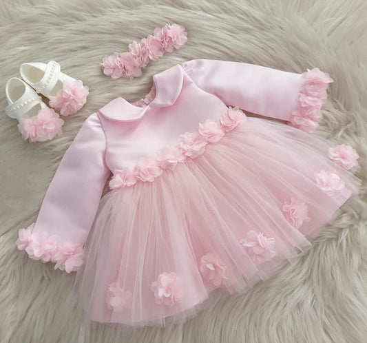 Pink tulle frock with flower sleeves for a baby girl