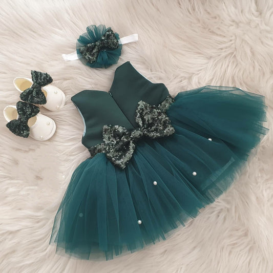 Teal tulle frock with sequin bow for a baby girl