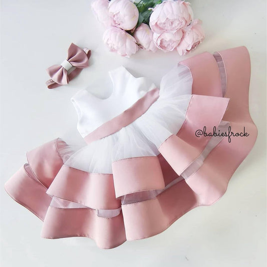White and pink layered satin frock for a baby girl