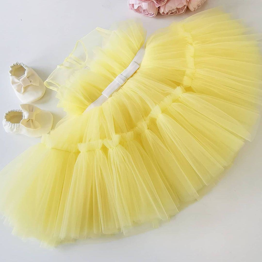 Yellow layered tulle frock for a baby girl