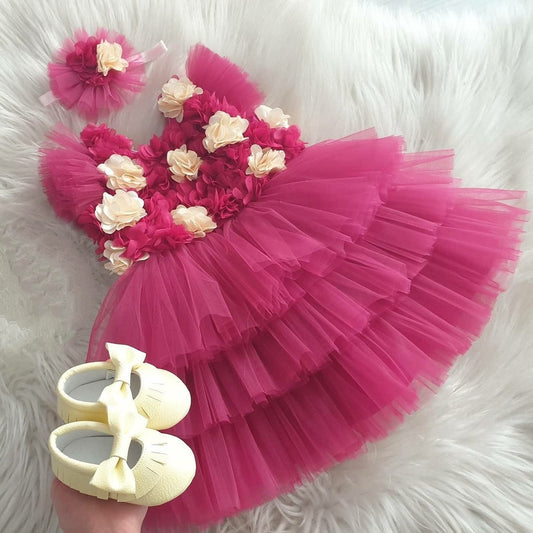 Fuchsia tulle frock with cream flowers for a baby girl