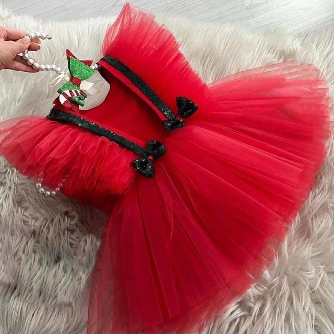 Red tulle frock with black sequin bows for a baby girl
