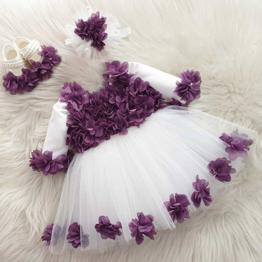 White tulle frock with purple flowers for a baby girl