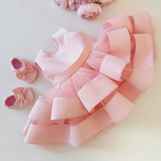 Peach layered organza frock for a baby girl