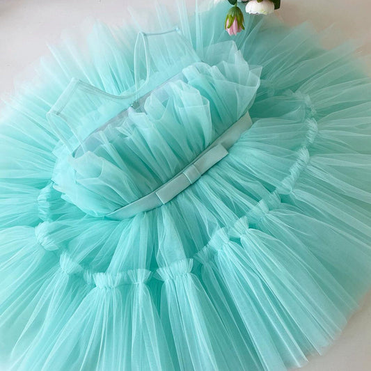 Aqua tulle frock with satin sash for a baby girl