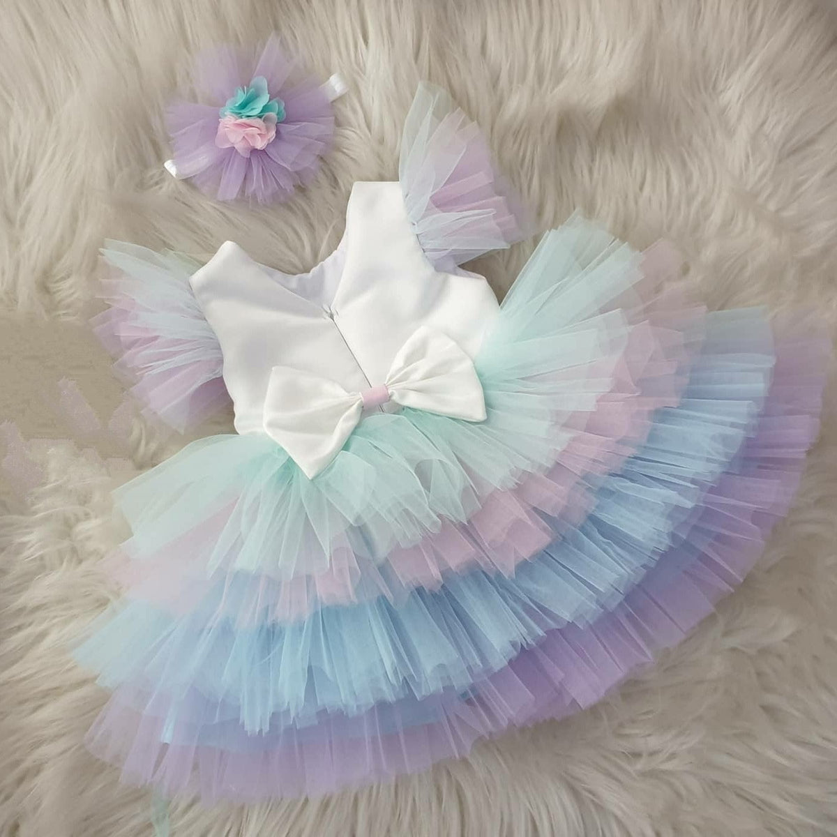 White frock with pastel rainbow tulle for a baby girl