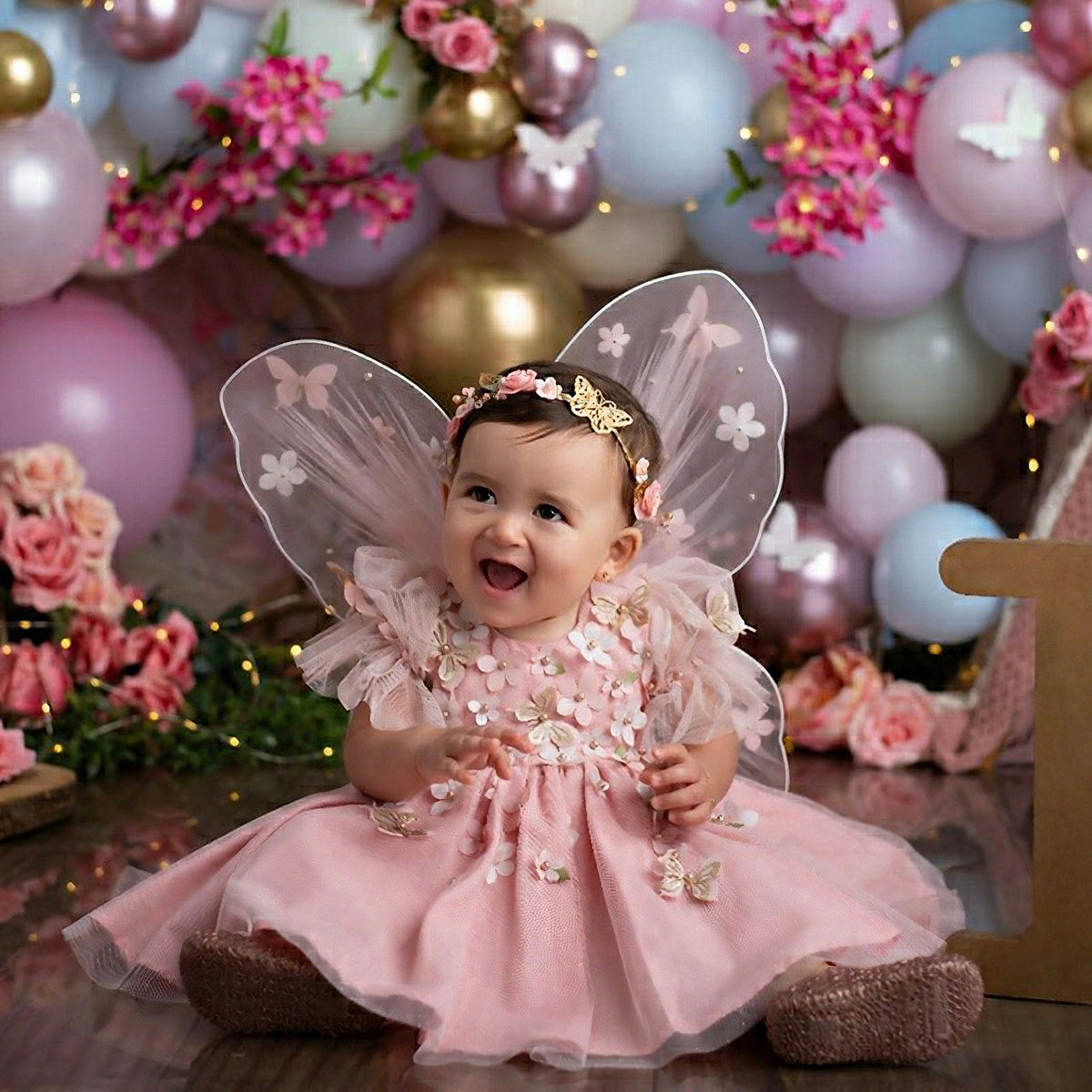 Blush butterfly frock with wings for a baby girl