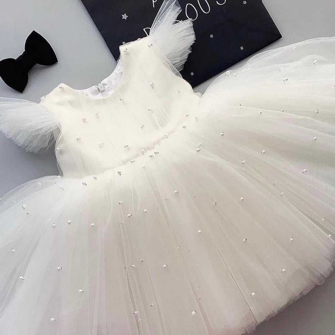 White pearl tulle frock for a baby girl