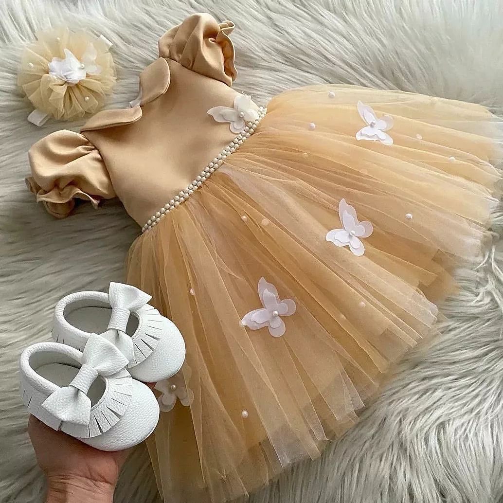 Gold tulle frock with butterflies for a baby girl